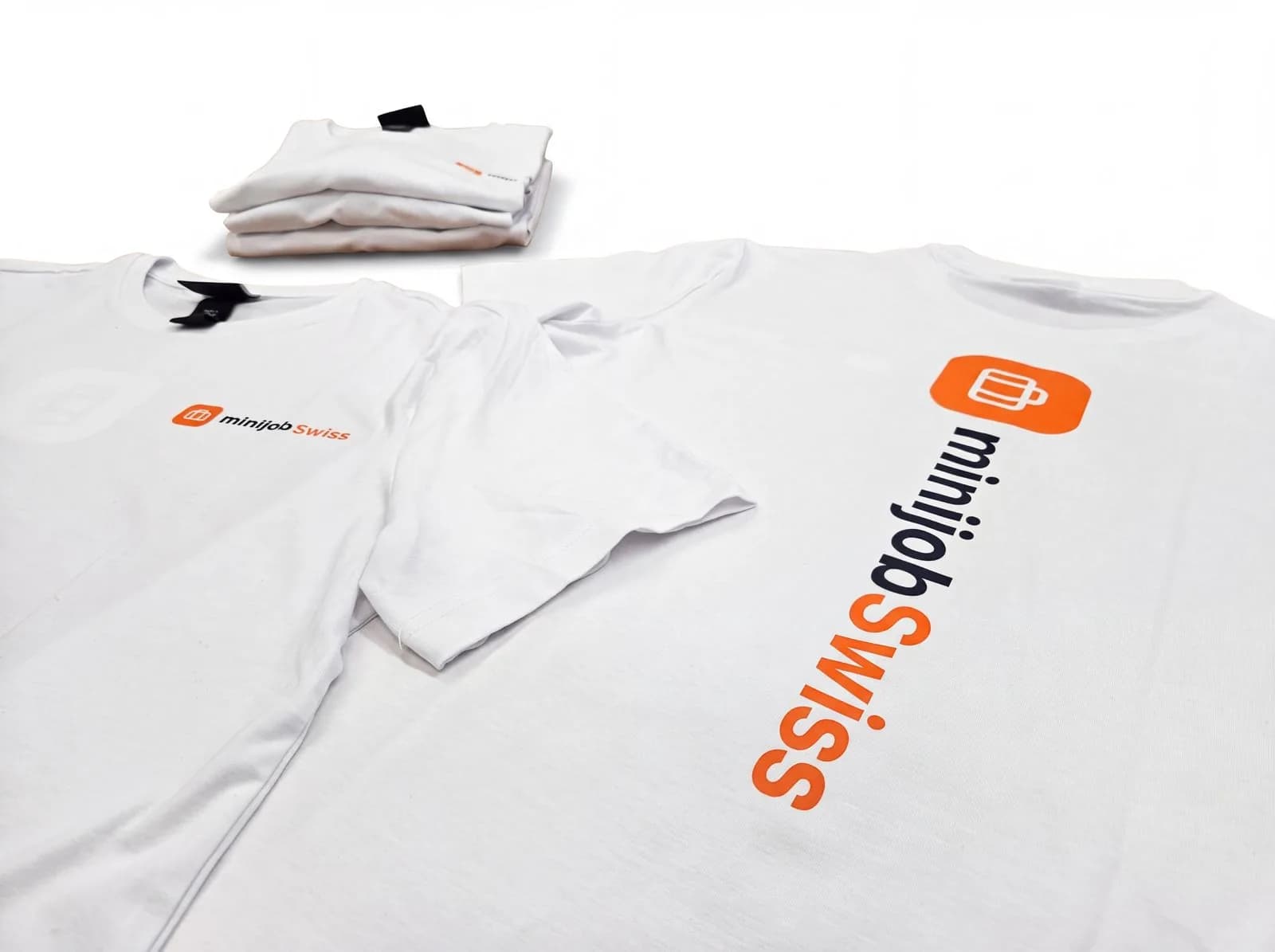 minijob Swiss – T-Shirts und Kugelschreiber mit Logo für minijob Swiss.